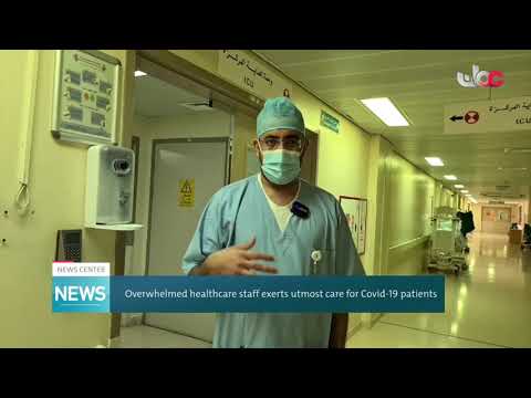 overwhelmed healthcare staff exerts utmost care for covid-19 patients