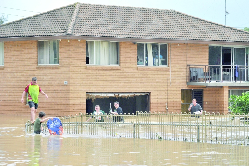 Australia orders 200,000 to flee floods, city of Sydney spared