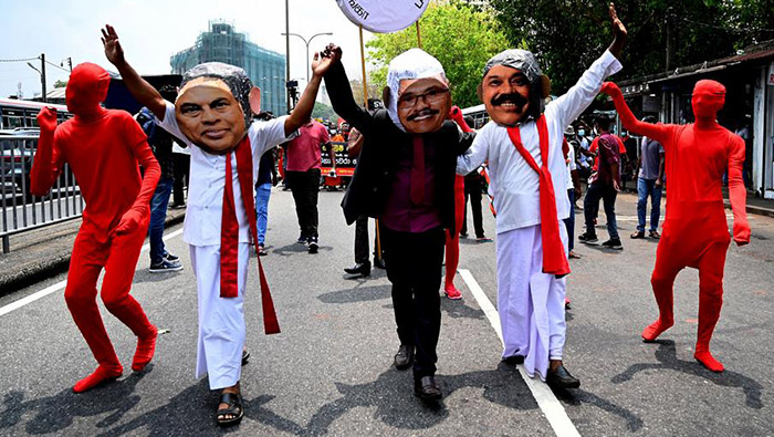 Sri Lanka's President drops 3 relatives in new Cabinet amid protests