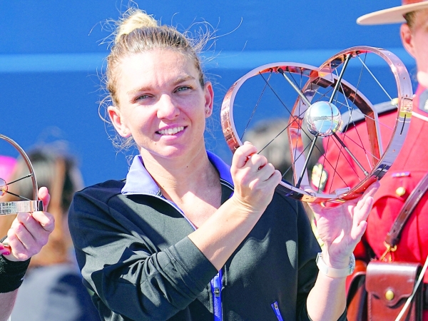 Halep holds off Haddad Maia to grab Canadian crown