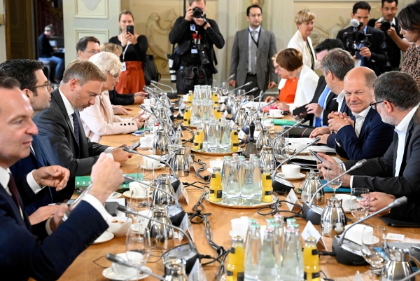 German cabinet seeks to lift political pressure at meetings