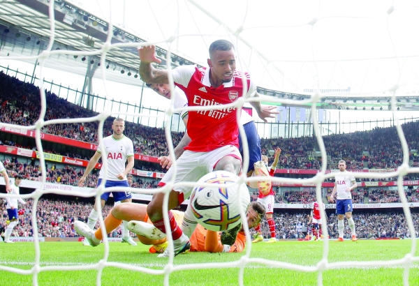Arsenal stay top with derby win as Tottenham self-destruct