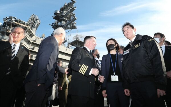 Japan PM pledges to boost military capacity