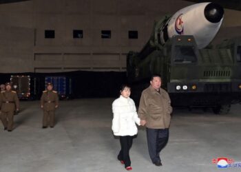 North Korean leader reveals daughter at missile launch