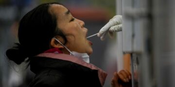 China COVID cases steady as many Beijing businesses, schools shut