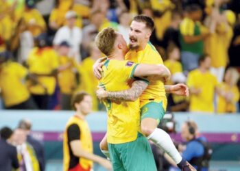 Australia reach World Cup last 16 and send Denmark home