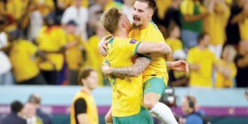 Australia reach World Cup last 16 and send Denmark home