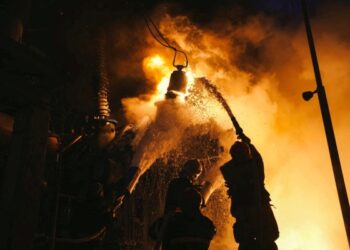 Russian drones hit Kyiv, Putin arrives in ally Belarus