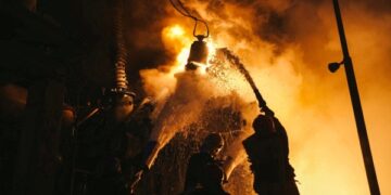 Russian drones hit Kyiv, Putin arrives in ally Belarus